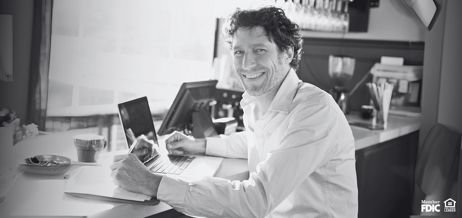 business owner smiling while working