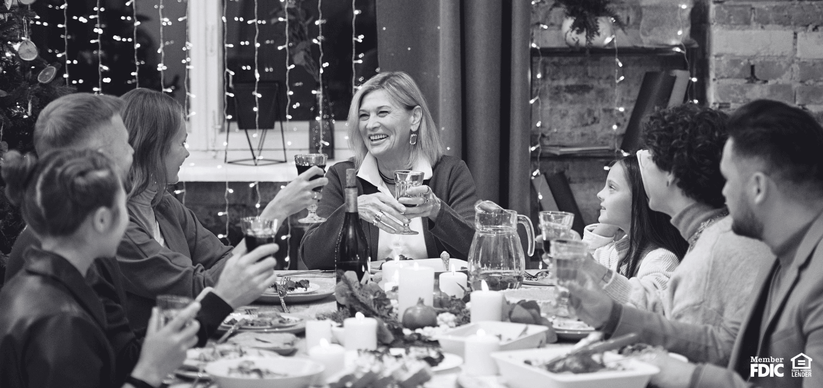 a family gathered around the table sharing a meal together
