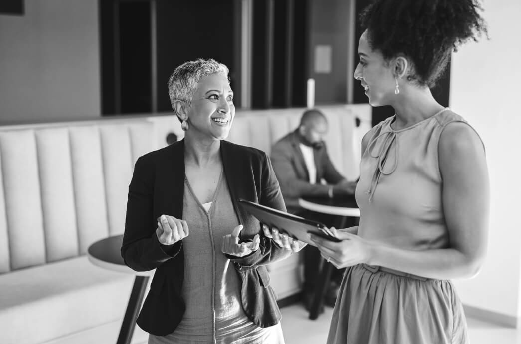 Business women talking together in their office