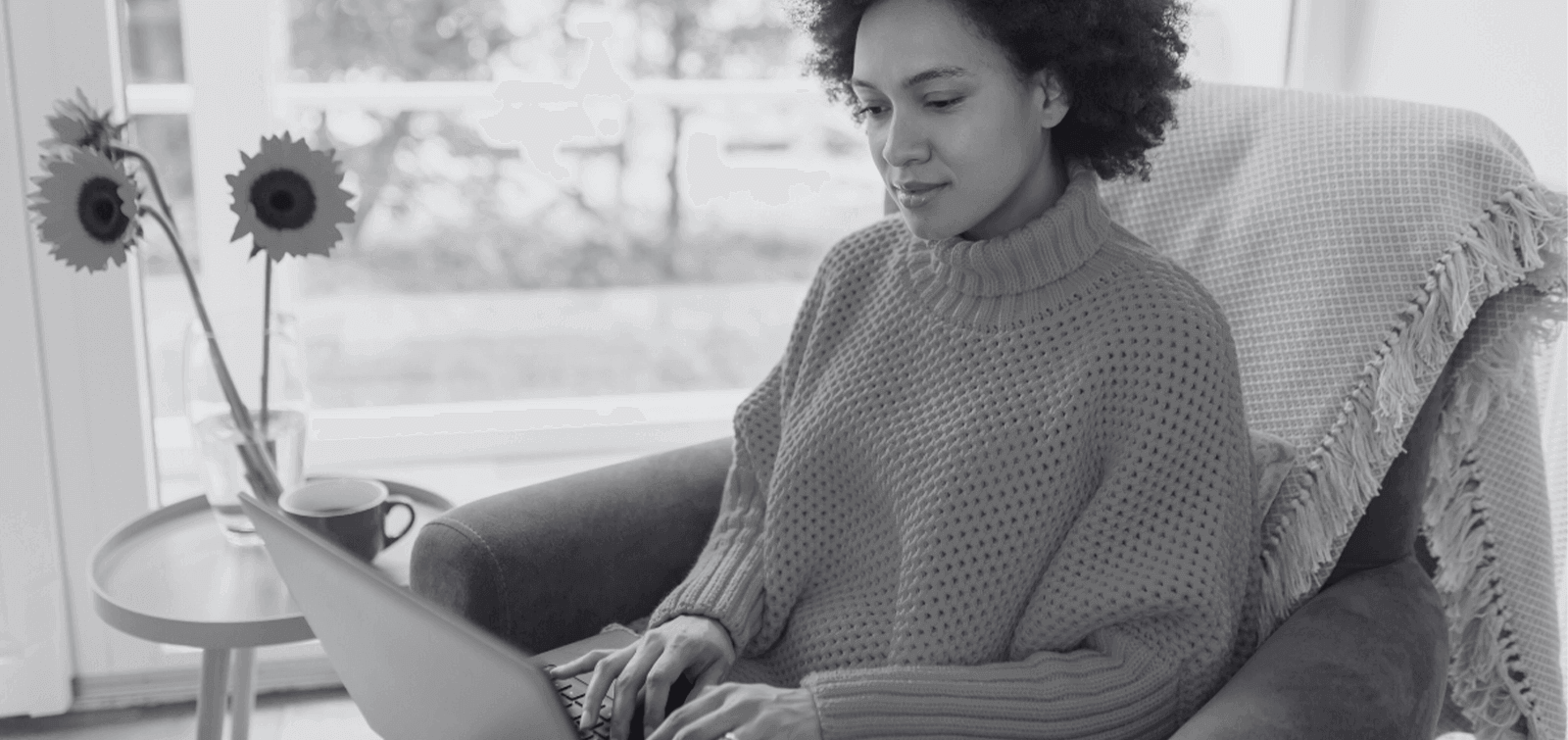 a woman uses online banking to transfer money into her emergency account