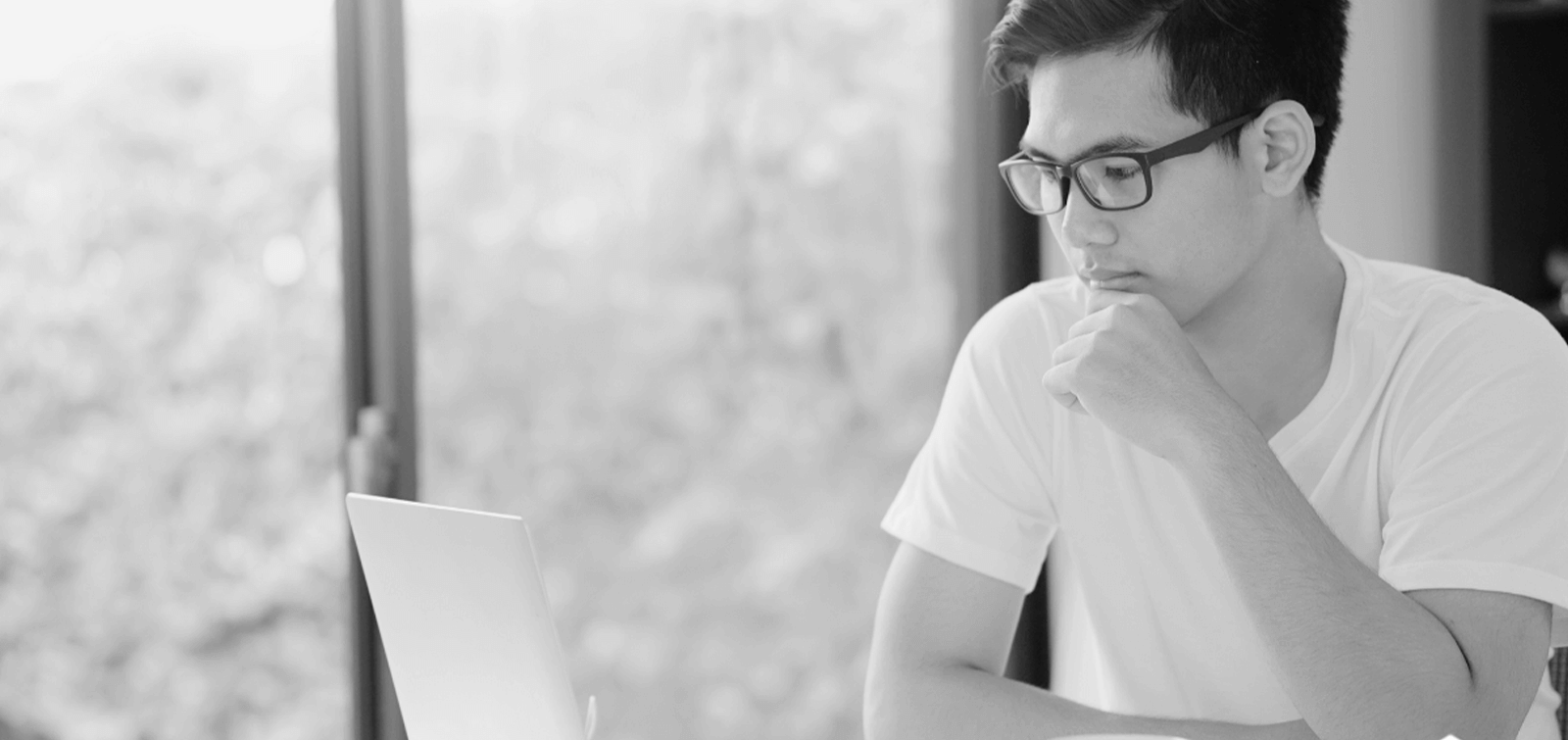 a soldier applies for a personal military loan on his laptop
