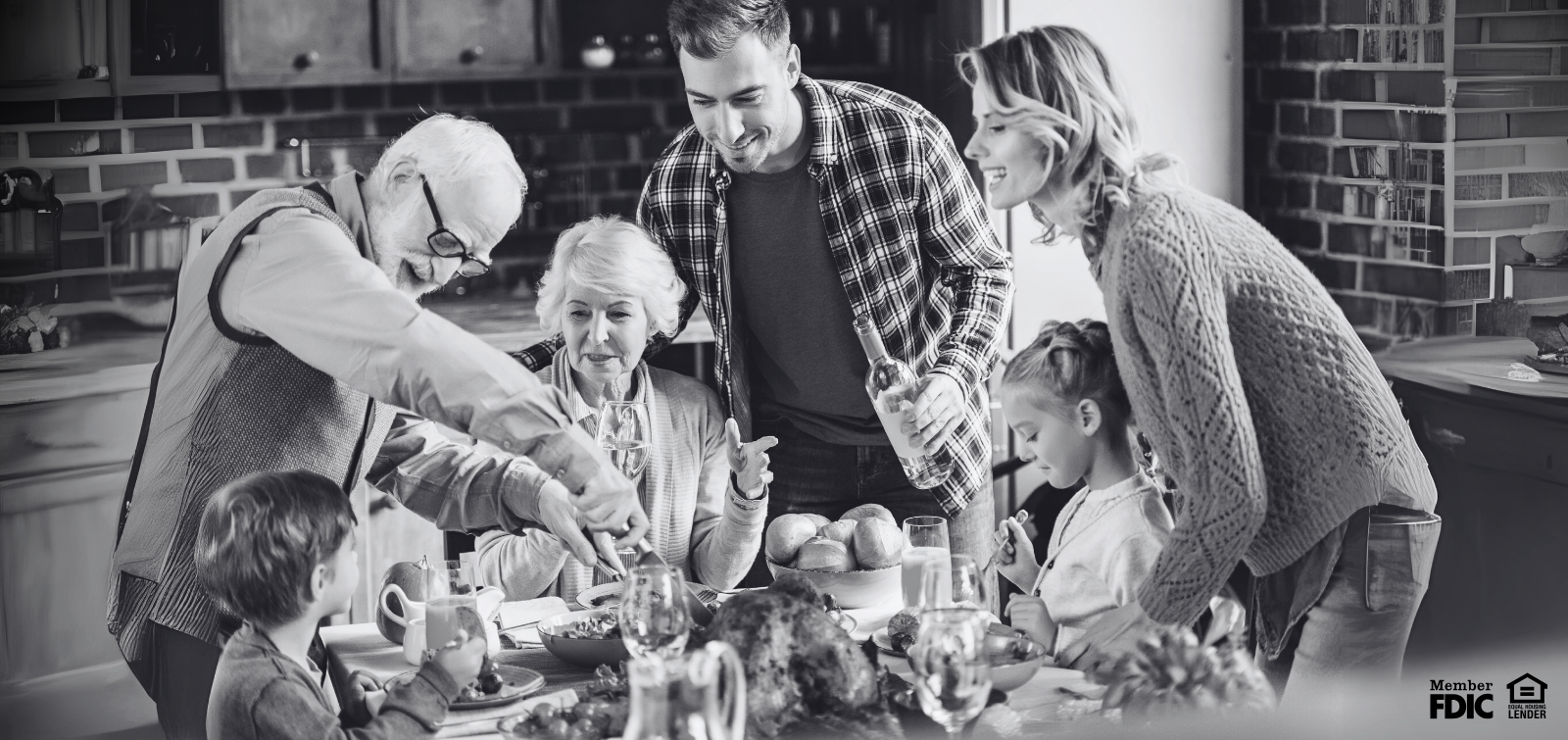 family watching grandfather carving a turkey