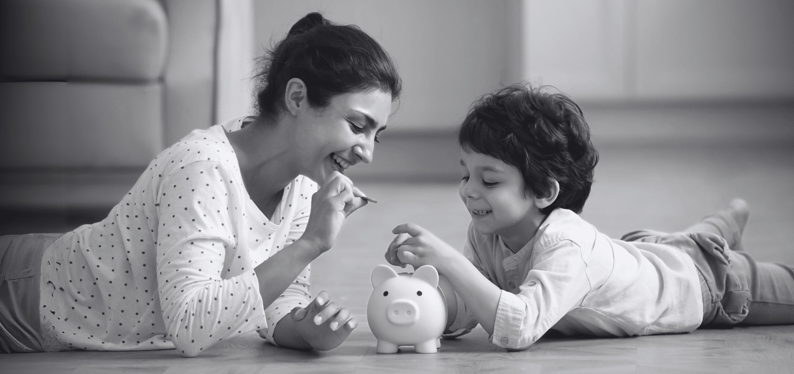 Mother teaching her son about the importance of saving money