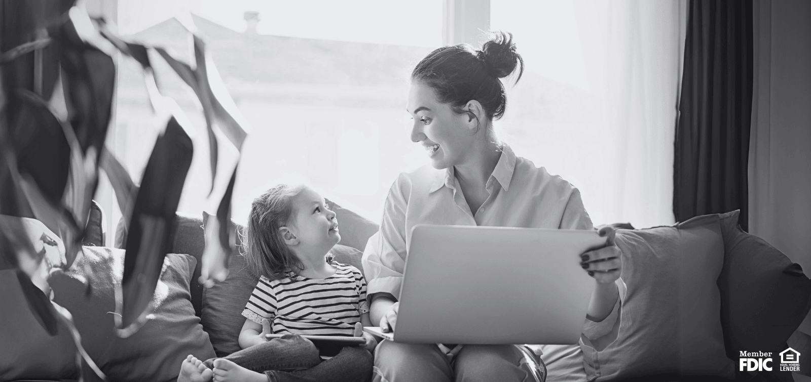Mother and daughter sit in their home, feeling thankful that mortgage is affordable.